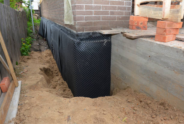 Happy homeowners after waterproofing job in Liberty Mills